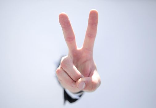 close up. businessman showing a gesture of victory.