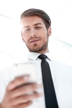 close up.business man reading an SMS on the smartphone