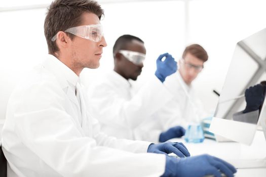 group of scientists conduct research in the laboratory