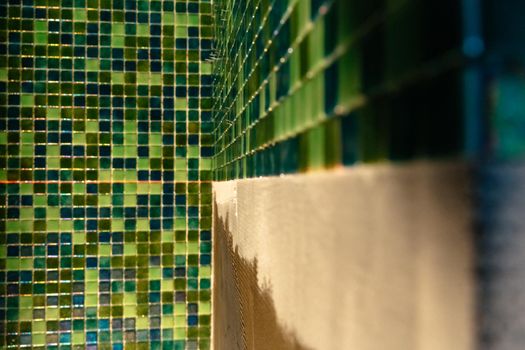 Applying modern mosaic tiles, sauna renovation
