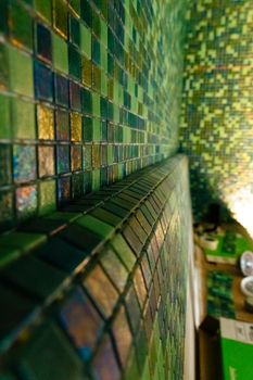 Modern green mosaic tiles on wall, bathroom interior design