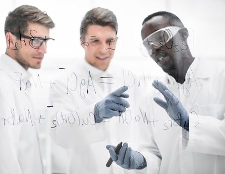 group of scientists discuss the results.
