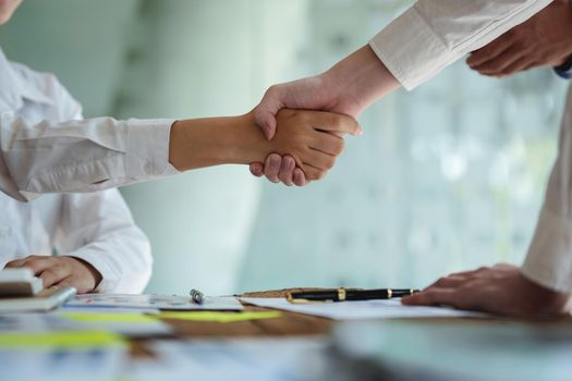 Business partnership meeting concept. Image business people handshake. Successful business and partner handshaking after good deal.