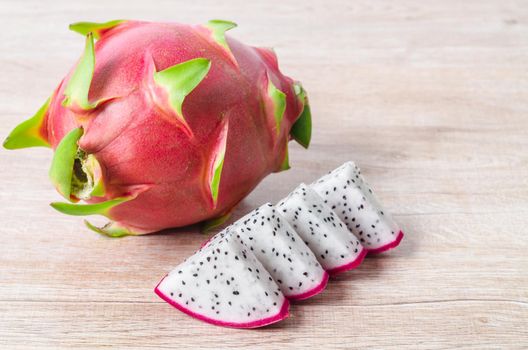 Tropical dragon fruit or pitaya on wooden wooden background