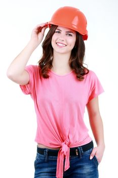 Young playful woman in shirt and jeans and orange helmet