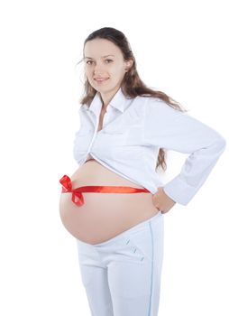 pregnant woman with red ribbon tied on the stomach