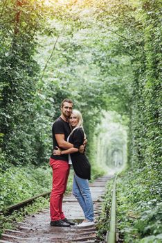 Loving couple on the iron road. Ukraine.