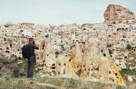 man photographs the ancient city