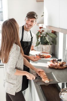 happy young couple standing in their new kitchen
