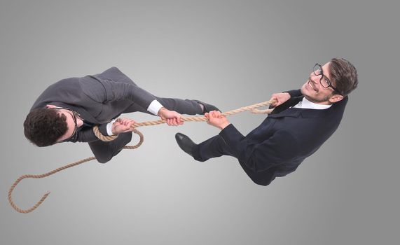 top view. two young businessmen pulling the rope