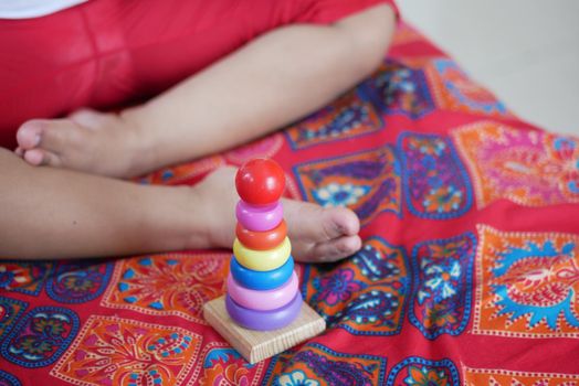 child playing with a Baby toys on bed, Child development concept.