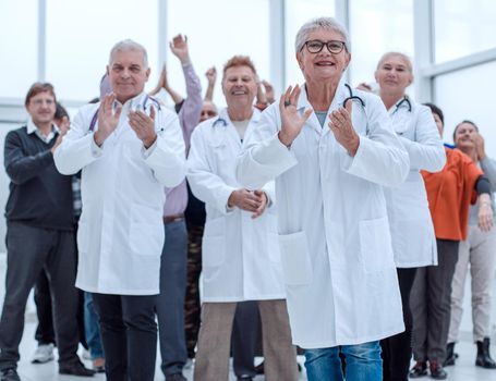 doctors and patients clap their hands. applaud and enjoy success