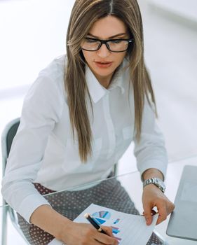 business woman checking financial documents.photo with text space