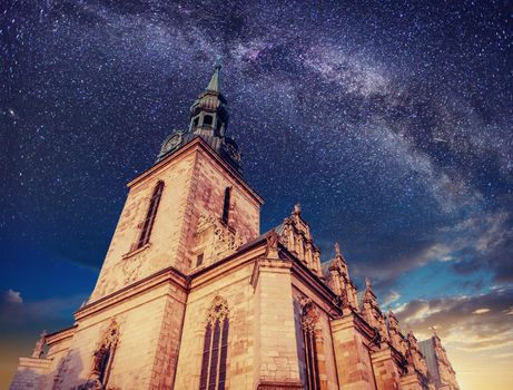 Architecture outside church. Night time starry sky. Retro stale.