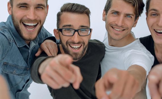 friendship and people concept - a group of smiling male friends pointing at you