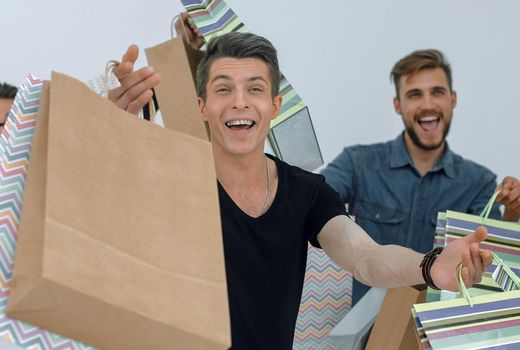 group of cheerful young people with shopping bags.photo with text space