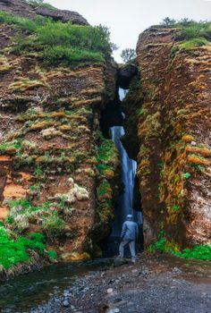Extreme beautiful waterfall Gljufrafoss, hidden in a gorge in Ic