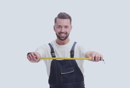 in full growth. smiling man with construction tape measure