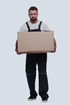 in full growth. a smiling man with cardboard boxes on his shoulders