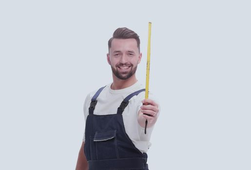 man in overalls with a construction tape measure. isolated on white