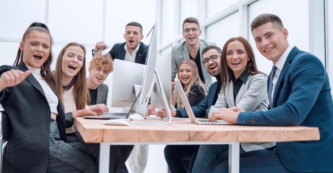 team of young professionals sitting at an office Desk