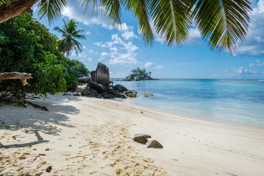 Mahe Seychelles, tropical beach with palm trees and a blue ocean at Mahe Seychelles Anse Royale beach Seychelles Mahe