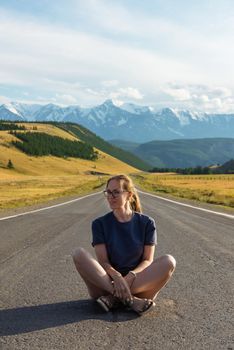 Woman om the Chuysky trakt road in the Altai mountains.