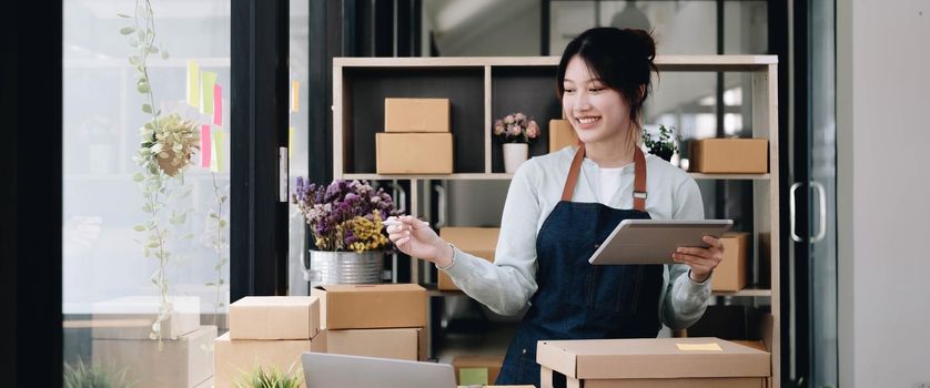 Small Entrepreneurs Start A Home Business By Arranging Goods With Brown Parcel Boxes, Small Home Business Startup Ideas.