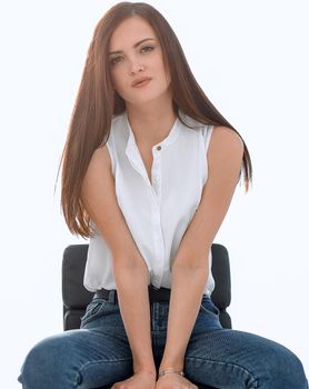 beautiful young woman sitting in a chair