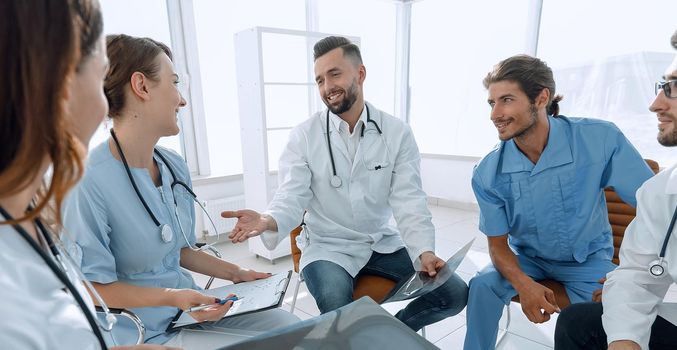 medical staff discussing x-ray of a patient