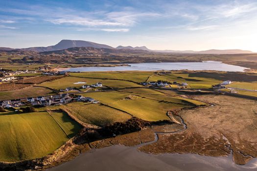 Aerial view of Dunfanaghy with the Muckish in background in County Donegal at sunset - Ireland