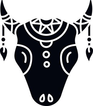 Tribal cattle head black glyph icon. Cow skull with feathers, Native American Indian symbol in boho style. Wild animal head. Silhouette symbol on white space. Vector isolated illustration