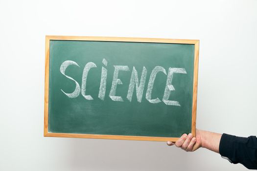 chalkboard with SCIENCE handwritten in chalk