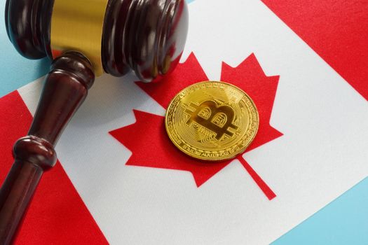 Cryptocurrency legislation in Canada. Flag and gavel.