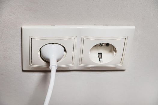 There are two white sockets in the center, one is free, the device is connected to the second