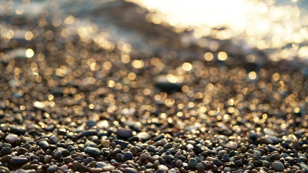 The coast of the Black Sea strewn with pebbles. Abstract natural landscape background concept