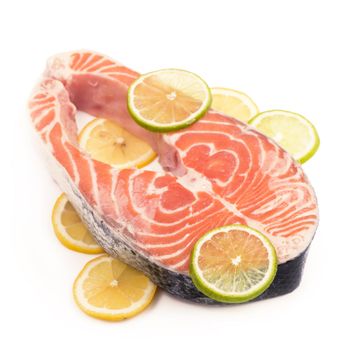 Sliced piece of fish. Steak of red fish on white background