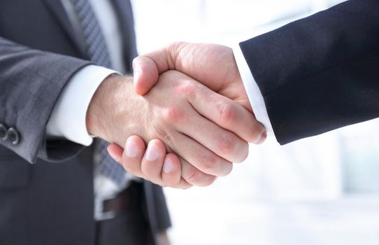 Closeup of Business Leader Shaking Partner Hand