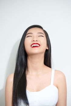 Young Asian woman with smiley face isolated on white background.