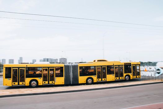 Ukraine, Kyiv - 27 June 2021: Yelow Municipal Bus moving on the street. Editorial