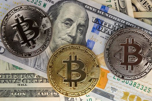bitcoin coins lie on dollars