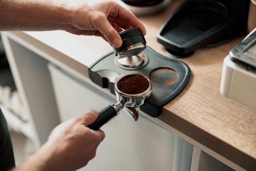 Process of preparing coffee tablet before inserting it into the coffee machine
