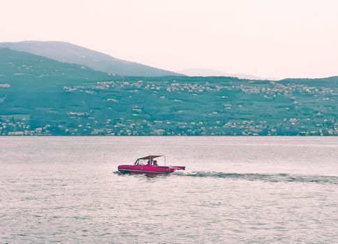 floating red amphibious car