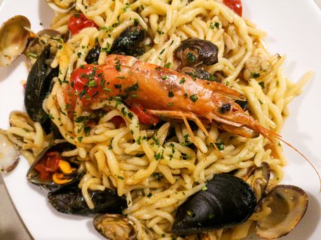 fresh pasta with freshly caught fish with mussels and shrimp