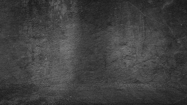 Old black background. Grunge texture. Dark wallpaper. Blackboard Chalkboard Concrete