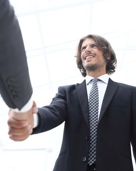 Success concept in business - handshake of partners