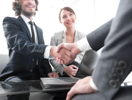 Two confidence businessman shaking hands close-up