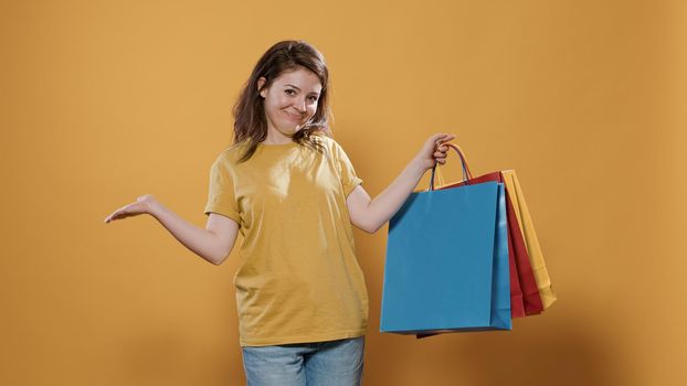 Portrait of woman feeling proud of purchase showing excitement for buying products