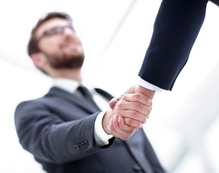 Handshake closeup of businesswoman and businessman.
