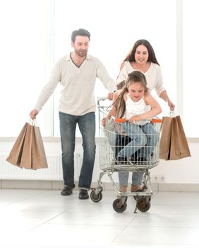 happy parents with children go shopping